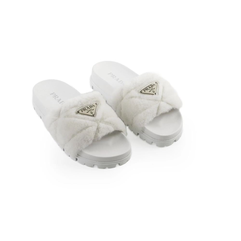 PRADA 
Shearling Metal Triangle Logo Lug Sole 20mm Slide Sandals 39 White